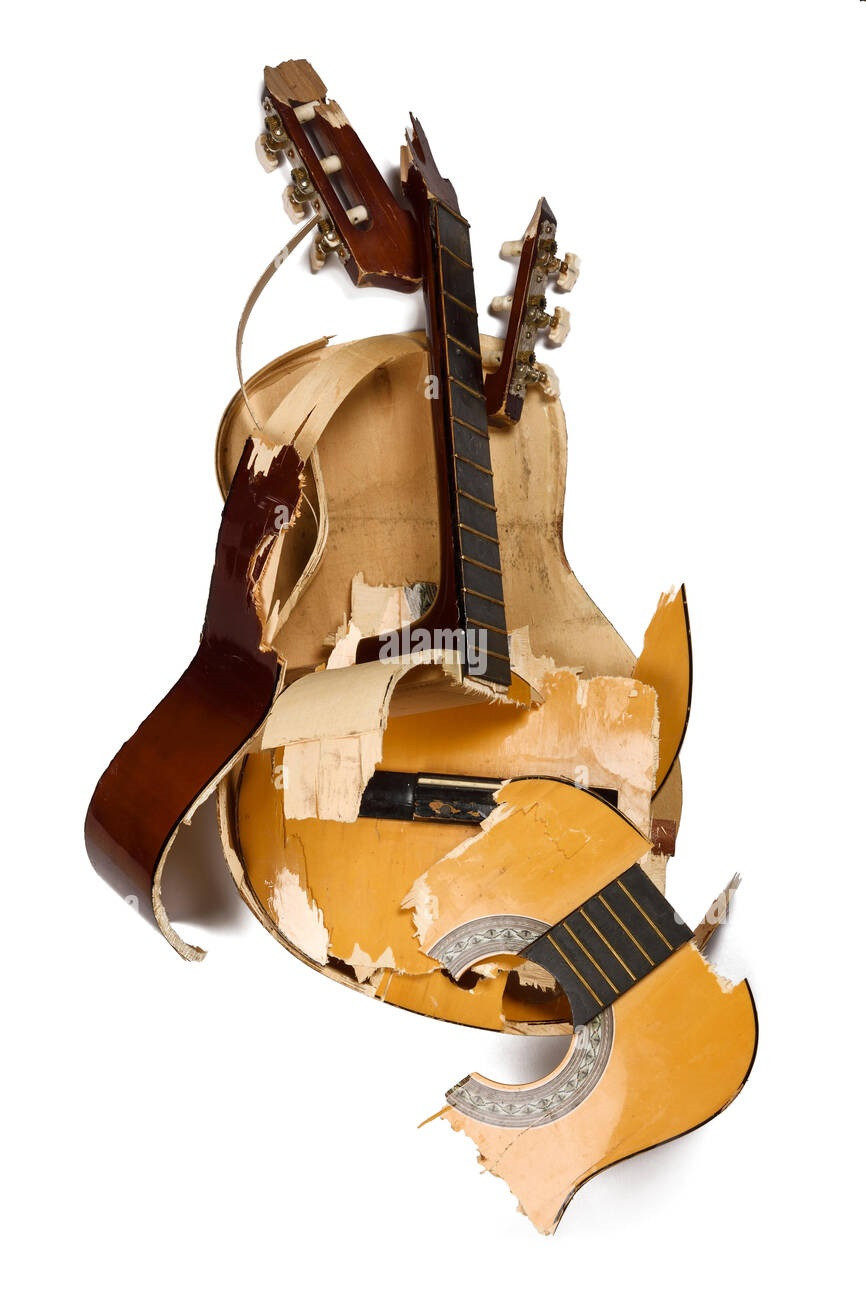 a-smashed-and-broken-acoustic-guitar-RCDEF9.jpg