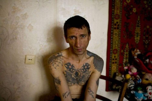 Tuesday, September 18, 2007: Andrei, zek. The origins of Russia's criminal caste lie deep in Russia's history. Huge territories of Russia were inhabited by prisoners and prison guards. Thieves, or zeks, distinguish themselves from others by tattoos marking their rank in the criminal world: there are different tattoos for homesexuals, thieves, rapists and murderers, etc.(Photograph by Donald Weber)